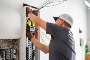 A contractor installing a SPAN smart panel